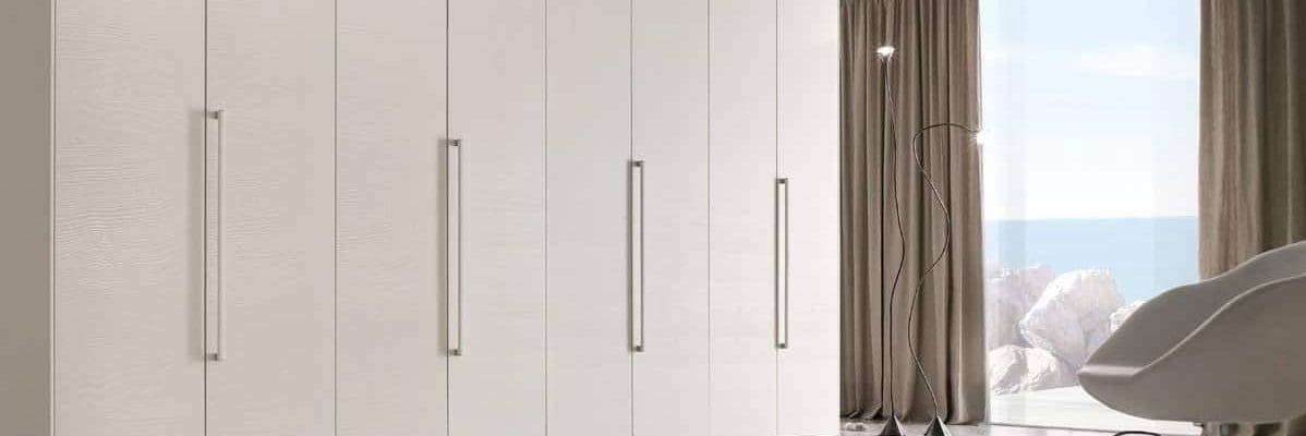 An image of a neatly crafted white wardrobe with a sleek and modern design.