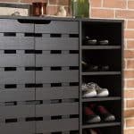 An organized shoe rack displaying a variety of neatly arranged shoes.
