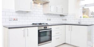 Visual comparison of L-shaped and parallel modular kitchen designs.