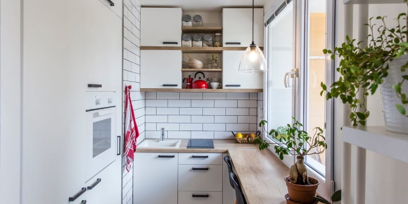 Small modular kitchen with compact design and space-saving storage.