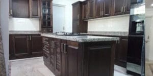A Mogappair modular island kitchen with well finished cabinets, a completed project by Hoop Pine.