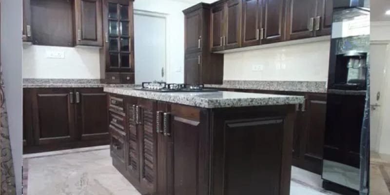 A Mogappair modular island kitchen with well finished cabinets, a completed project by Hoop Pine.